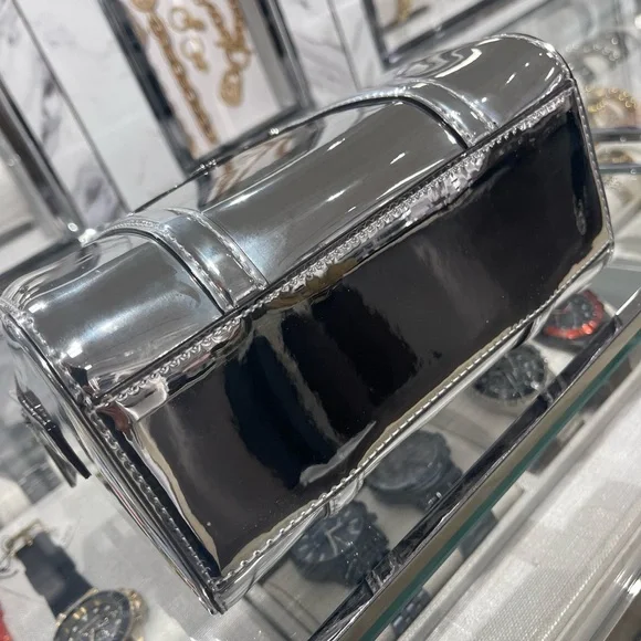 MICHAEL KORS Jet Set Small Patent Duffel Xbody Crossbody Bag
Silver 
NWT - Picture 13 of 16